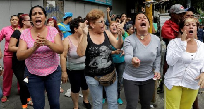 `We want food!`, Venezuelans cry at protest near presidency
